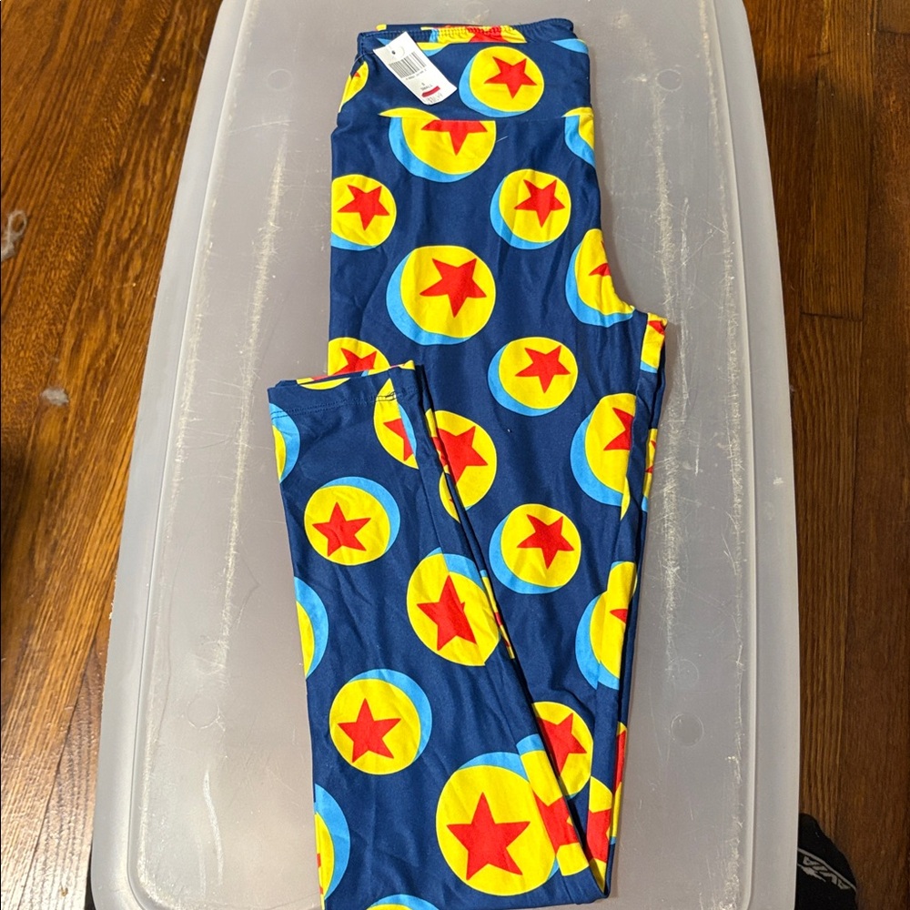 Disney Parks Blue Leggings with Red and Yellow Pattern